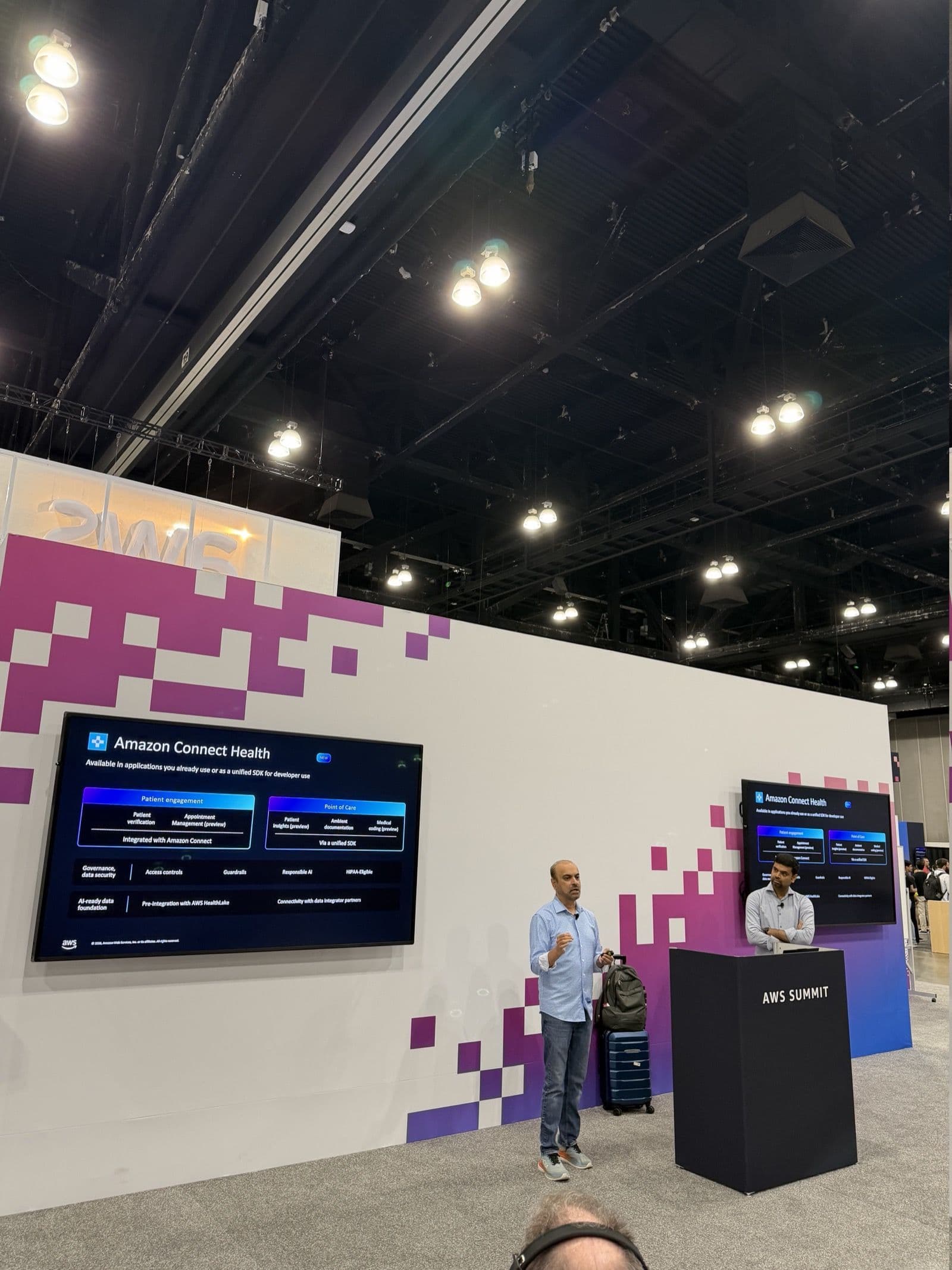 Amazon Connect Health presentation at AWS Summit showing patient engagement and point-of-care workflow concepts.
